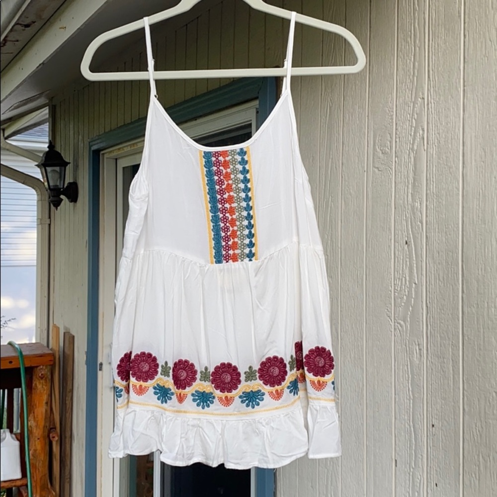 Embroidered flowy tank. New w/tag. Never worn.